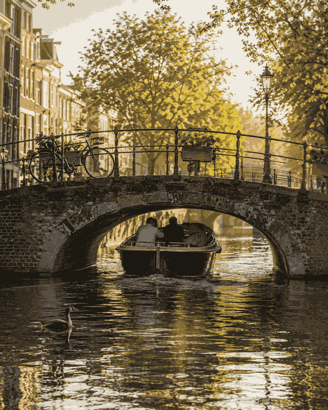 A boat passing under a low bridge with only a hand-span of clearance
